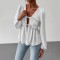 Elegant long-sleeved top, blouse. Loose-fitting V-neck, ruffled hem, contrasting lace-up design for a slimming, versatile shirt.