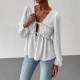 Elegant long-sleeved top, blouse. Loose-fitting V-neck, ruffled hem, contrasting lace-up design for a slimming, versatile shirt. Elegant long-sleeved top, blouse. Loose-fitting V-neck, ruffled hem, contrasting lace-up design for a slimming, versatile shirt.