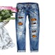European and American cross-border AliExpress trendy Halloween pumpkin ripped print jeans for women, mid-rise straight-leg pants