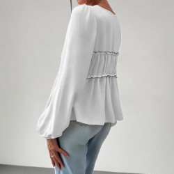 Elegant long-sleeved top, blouse. Loose-fitting V-neck, ruffled hem, contrasting lace-up design for a slimming, versatile shirt.