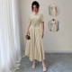 European and American women's polka-dot retro short-sleeved maxi dresses with a belt and decorative buckle for a slimming, fashionable dress. European and American women's polka-dot retro short-sleeved maxi dresses with a belt and decorative buckle for a slimming, fashionable dress.