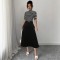 Striped contrasting turtleneck midi skirts for women, elegant slimming and flattering two-piece commuter suits.